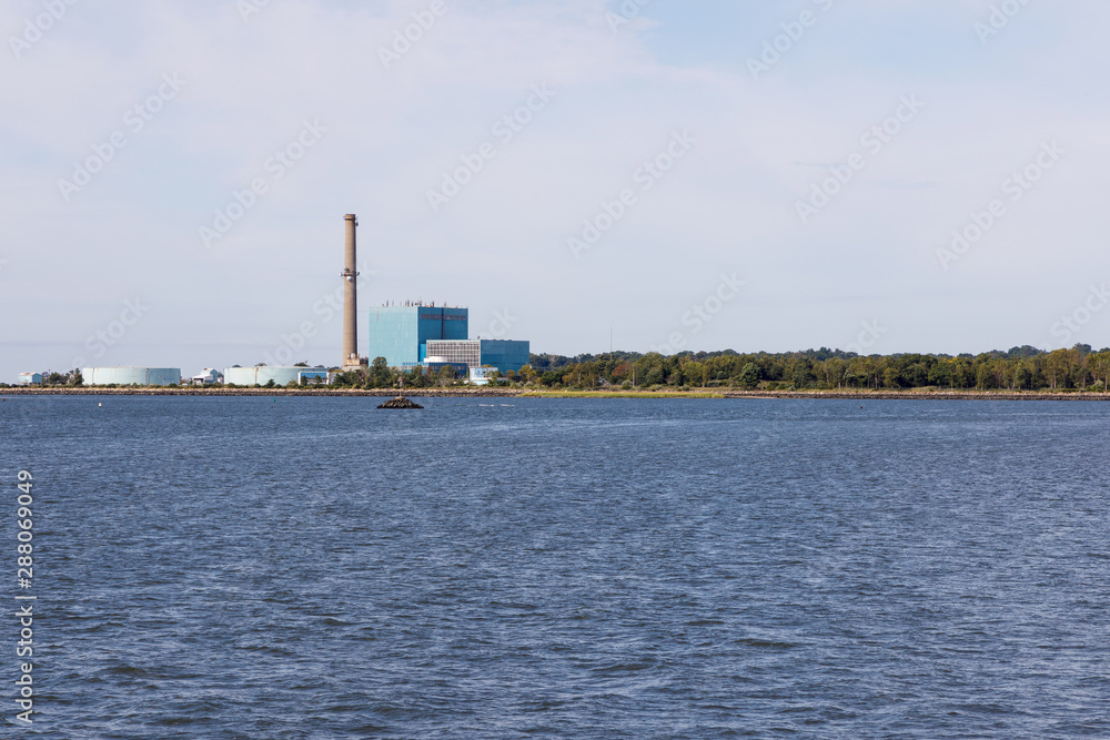 Deactivated Manresa Island coal fired electricity generating power plant in Norwalk, Connecticut, as seen across the Long Island Sound Deactivated Manresa Island coal fired electricity generating power plant in Norwalk, Connecticut, as seen across the Long Island Sound