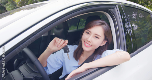 Asian woman hold car key