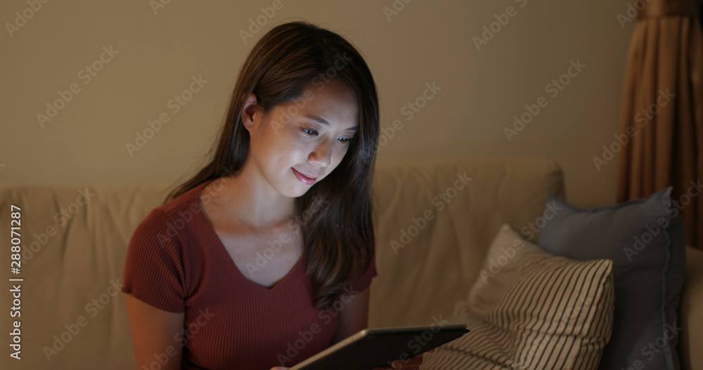 Young woman work on tablet computer at home Young woman work on tablet computer at home