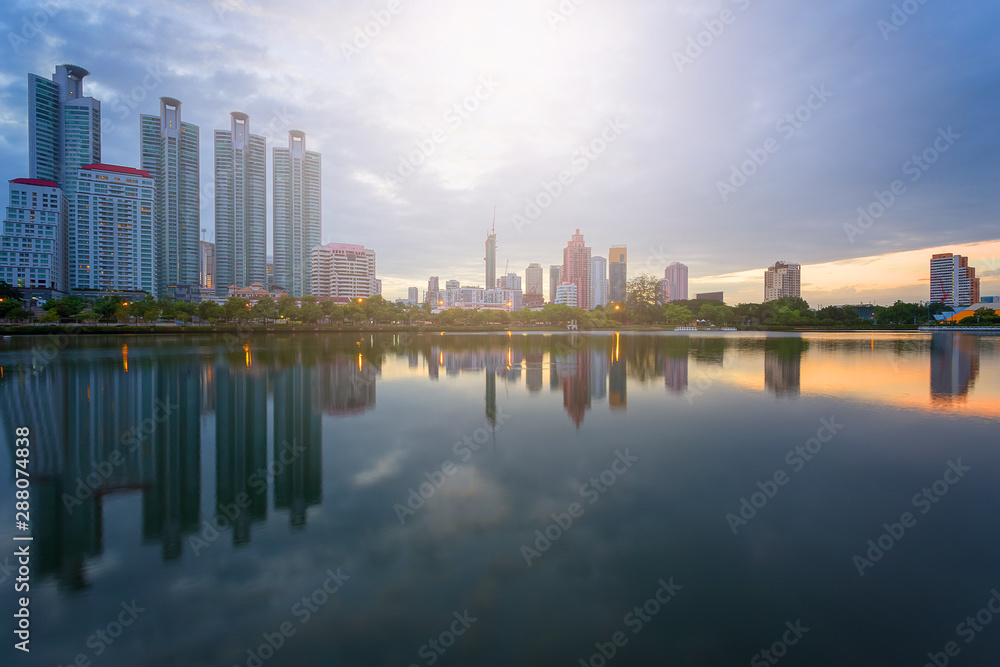 Fototapeta premium City building with water reflection before sunset