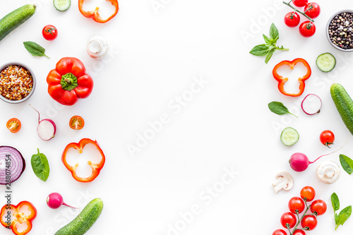 Sliced, cut, chopped vegetables frame on white background top view copyspace
