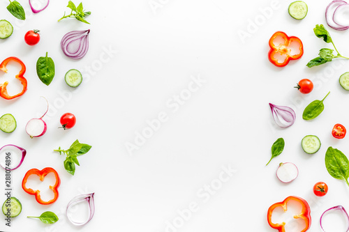 Sliced, cut, chopped vegetables frame on white background top view copyspace