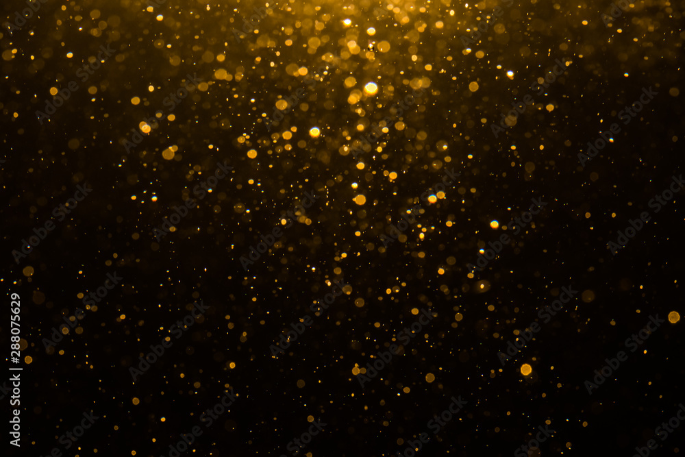 Abstract gold bokeh with black