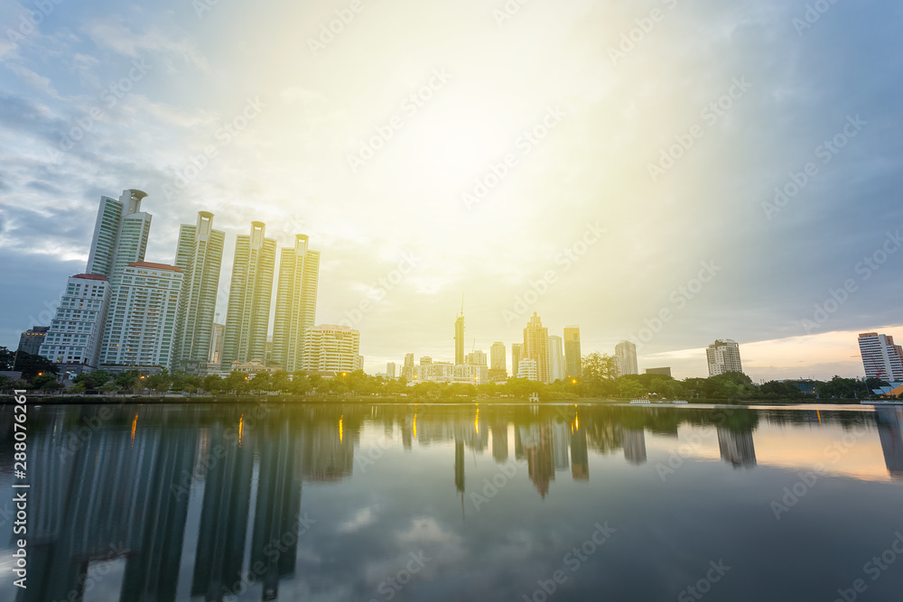 City building with water reflection before sunset