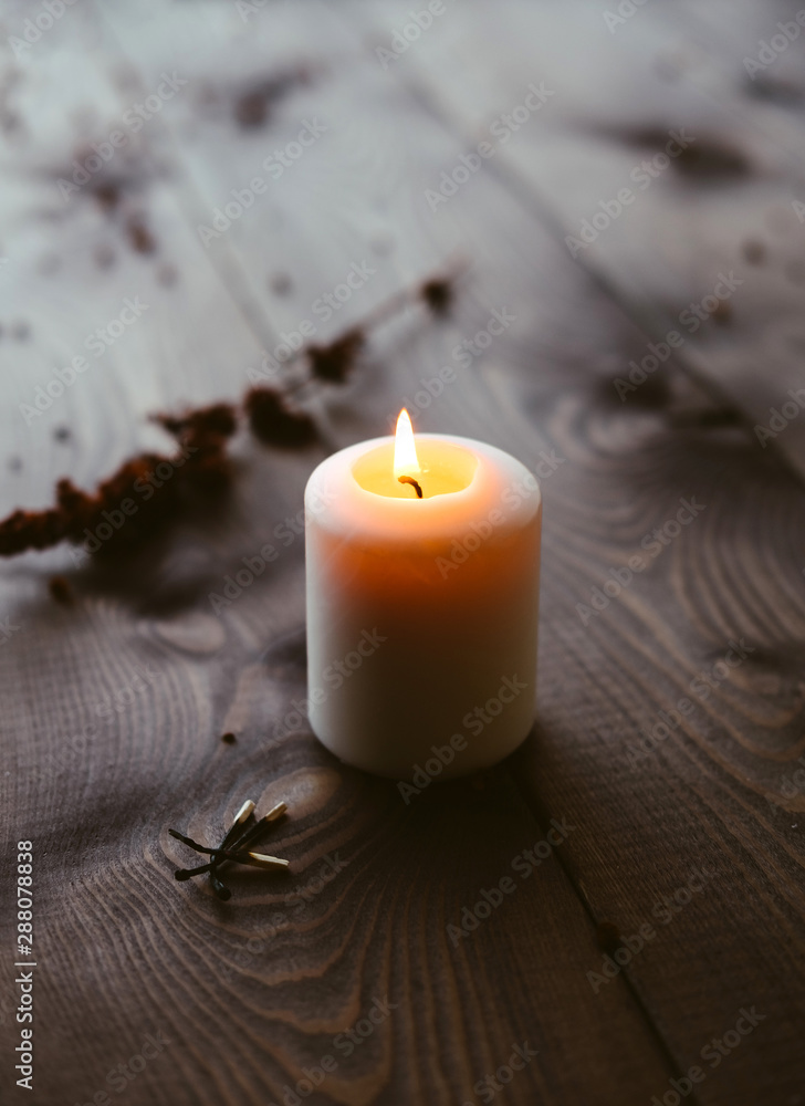 White Candles Burning On Wooden Tabletop White Candles Burning On Wooden Tabletop