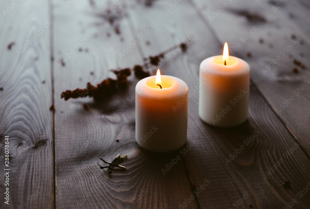 White Candles Burning On Wooden Tabletop White Candles Burning On Wooden Tabletop