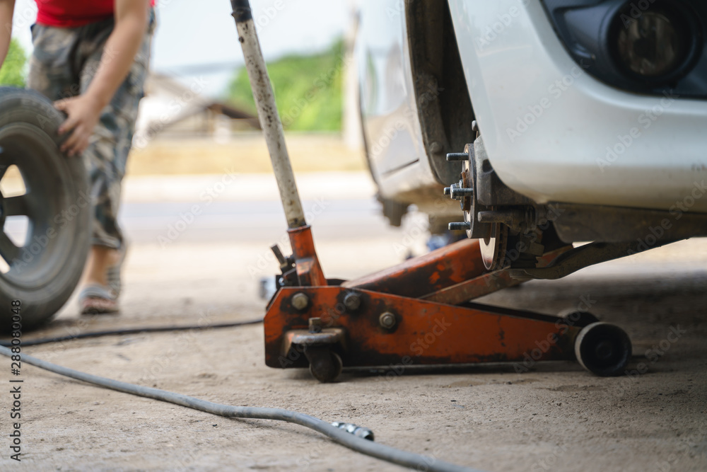 Fototapeta premium Car wheel changing service