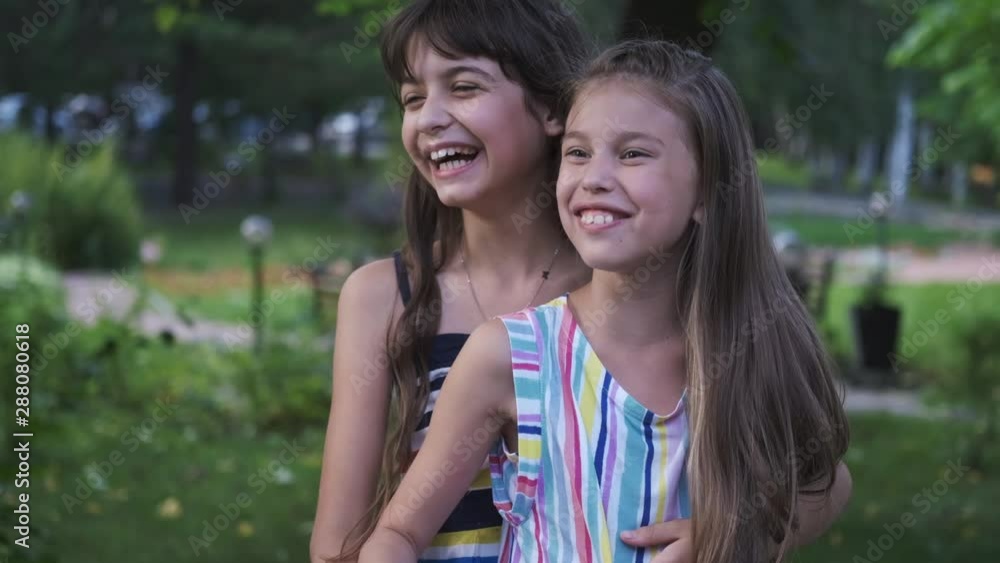 children hug and laugh. portrait of little friends children hug and laugh. portrait of little friends