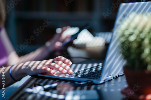 woman hands using smartphone, home office background, social media  influencer