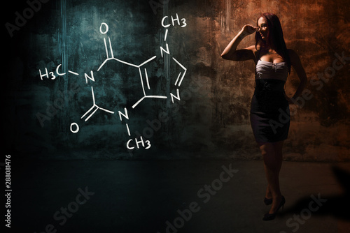 Sexy girl or secretary or female student presenting handdrawn chemical formula of Caffeine