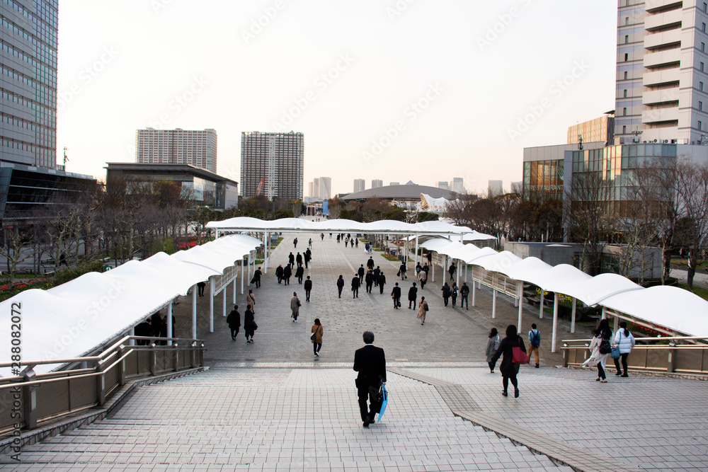 Japanese people and foreigners worker walking go to trains and bus station after finished work at tokyo big sight in Ariake at Koto city in Tokyo, Japan