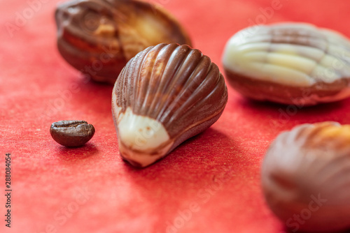 Swiss chocolate on red paper background.