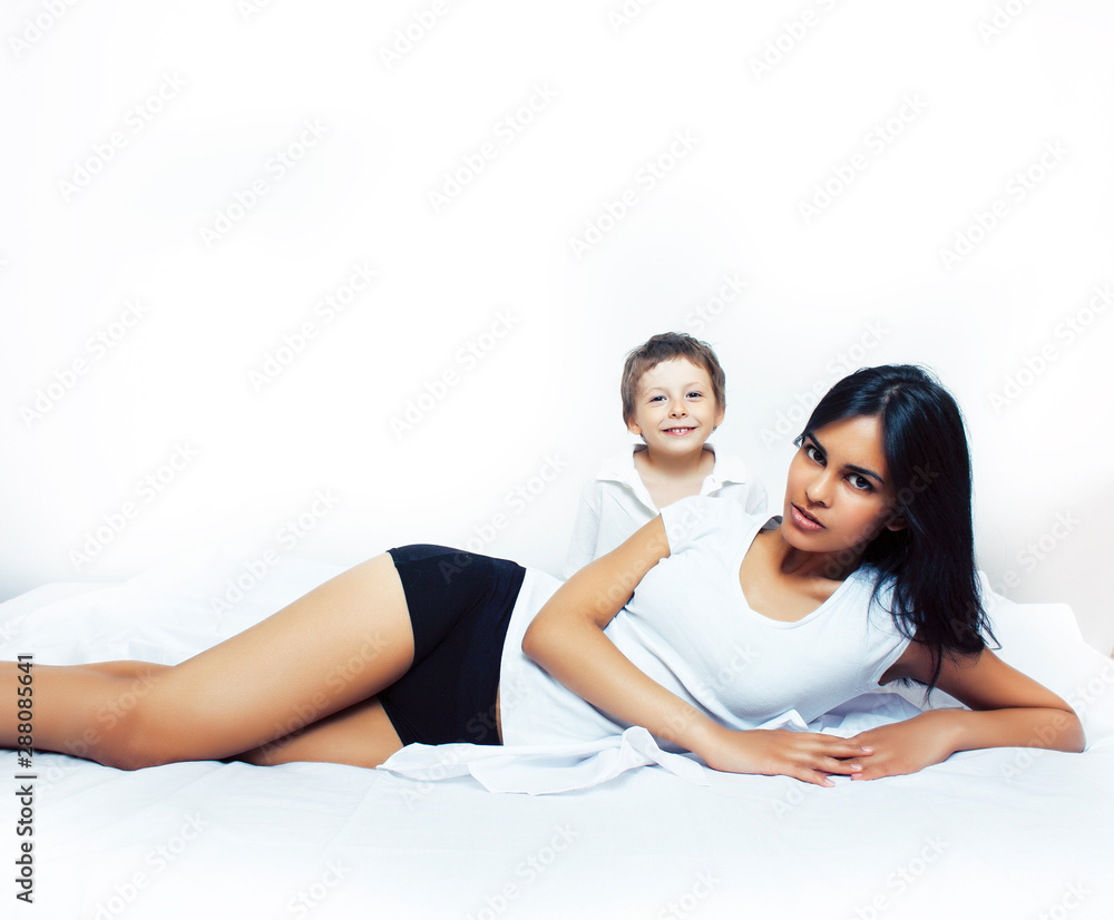 cute little boy in bed with mother in pajamas having fun happy smiling, lifestyle people concept cute little boy in bed with mother in pajamas having fun happy smiling, lifestyle people concept