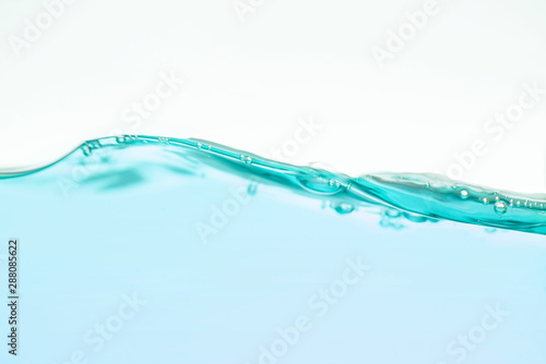 Water splash with bubbles on white background.