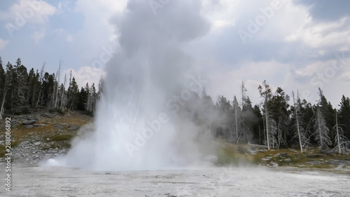 a grand geyser eruption in yellowstone national park