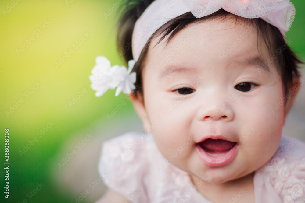 Close up portrait Asian cute baby girl with Natural light background Close up portrait Asian cute baby girl with Natural light background