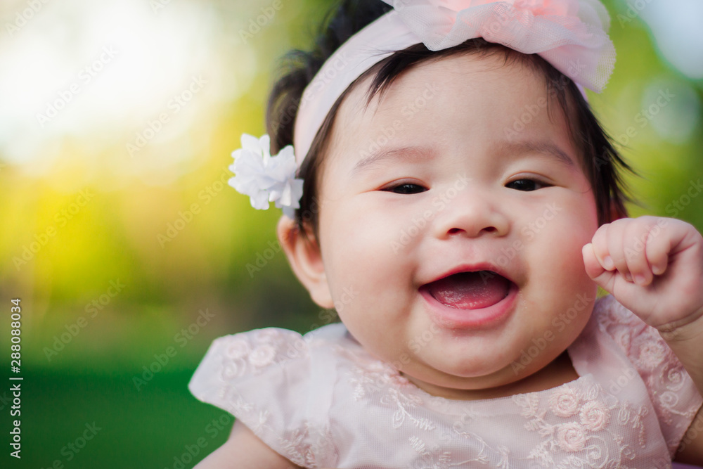 Close up portrait Asian cute baby girl with Natural light background Close up portrait Asian cute baby girl with Natural light background