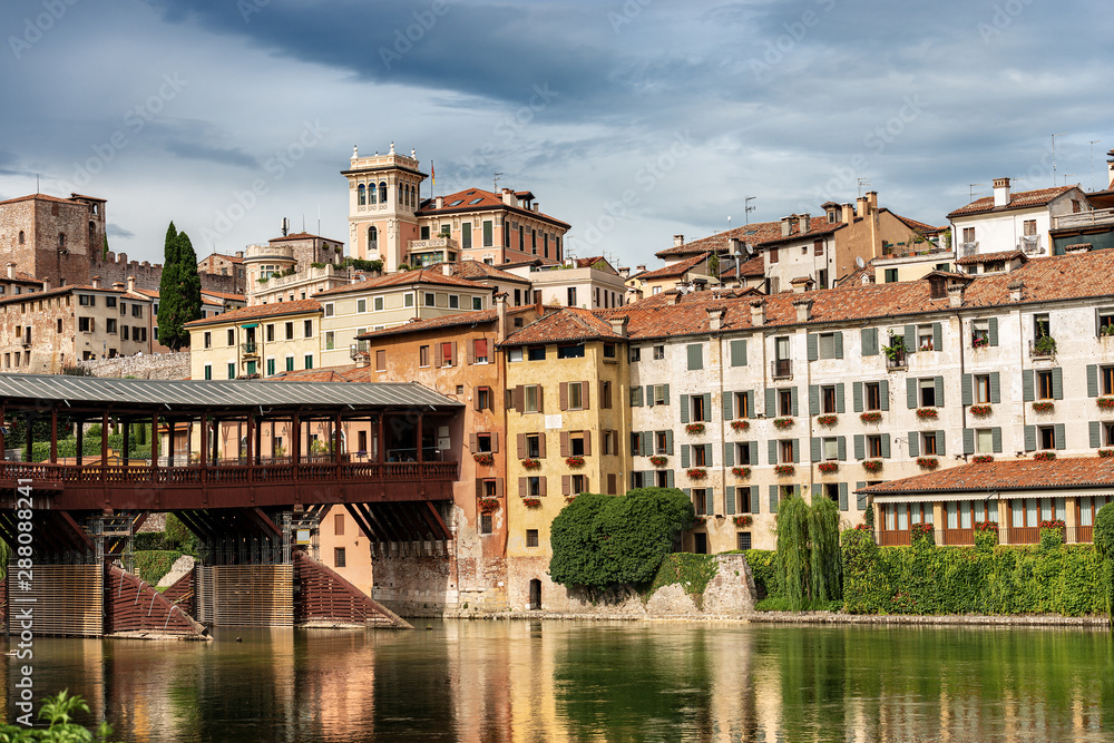 The old town of Bassano del Grappa with the River Brenta and the Ponte degli Alpini or Ponte Vecchio (Bridge of the Alpini). Vicenza, Veneto, Italy, Europe