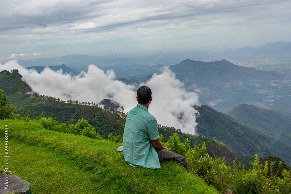 man Isolated soaking natural beauty from hill top