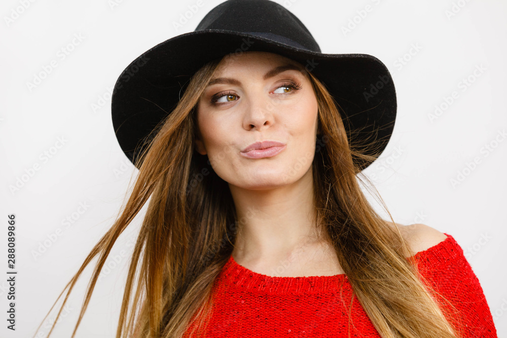 Smiling pretty girl with brown hair and black hat. Smiling pretty girl with brown hair and black hat.