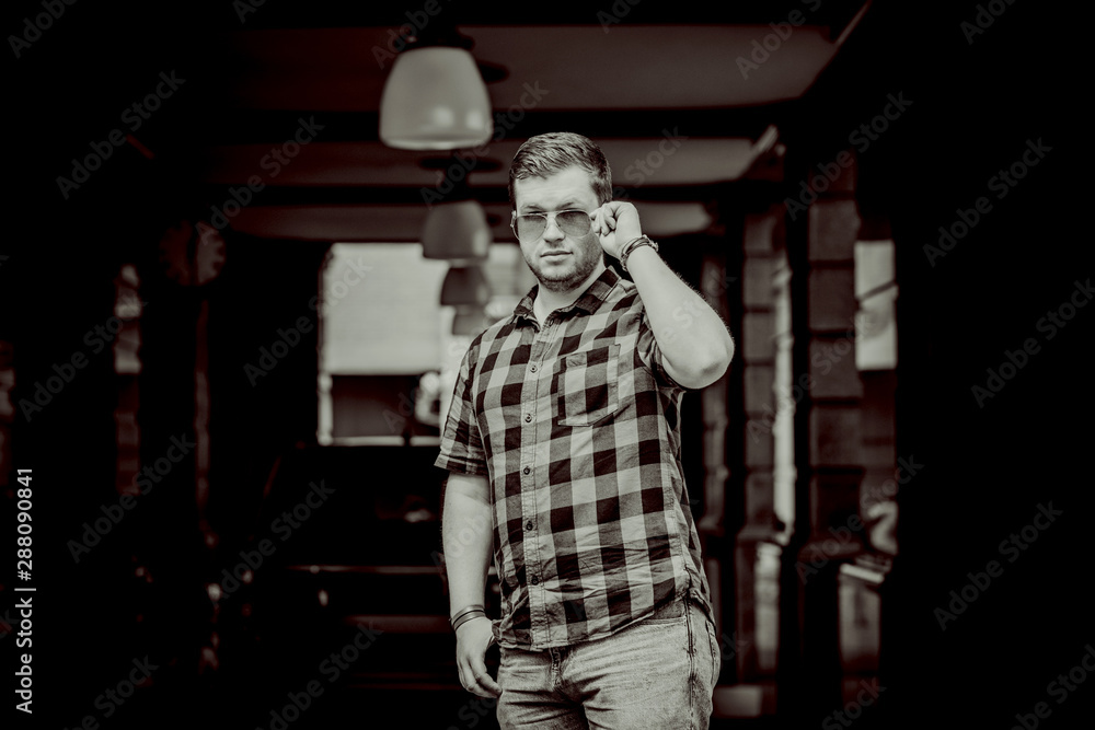 Fototapeta premium Philosophical portrait of young guy at city. Concept of modern young people 