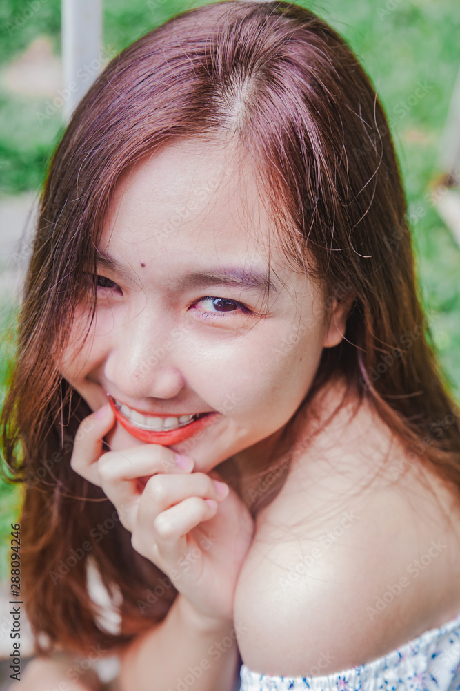 Asian woman relaxing at nature garden .