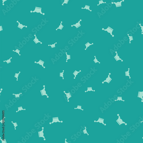 Green Jester hat with bells isolated seamless pattern on green background. Clown icon. Amusement park funnyman sign. Vector Illustration