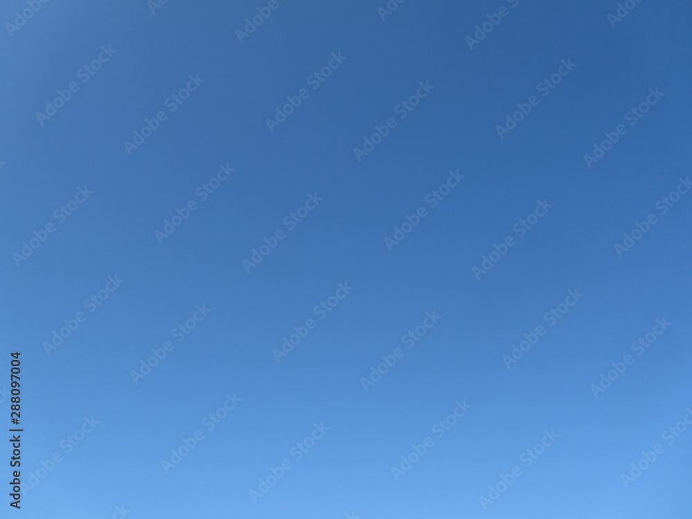 Clear blue sky background. The sky without clouds. Abstract blue background.