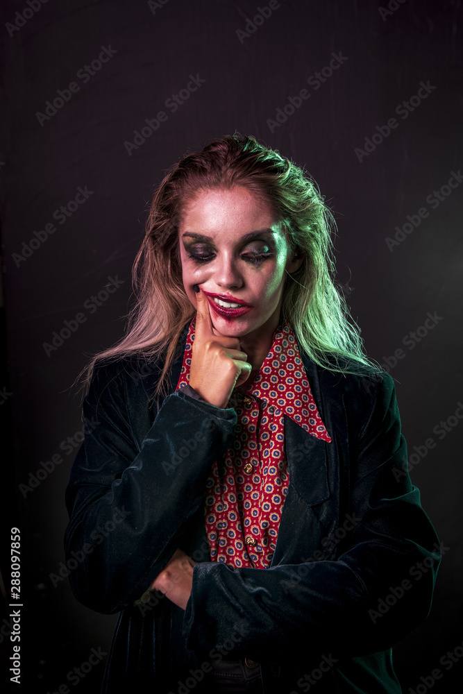Medium shot of woman dressed as a clown Medium shot of woman dressed as a clown