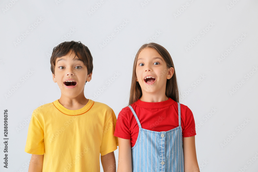 Portrait of emotional children on light background Portrait of emotional children on light background