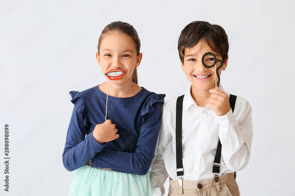 Cute little children with party decor on light background Cute little children with party decor on light background