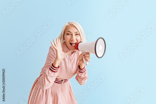 Mature woman with megaphone...