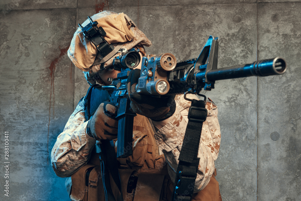 fully equipped army soldier in camo uniform and helmet, armed with pistol and assault service rifle fully equipped army soldier in camo uniform and helmet, armed with pistol and assault service rifle