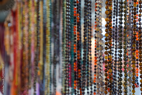 Indian beads and jewelry on the counter in store.