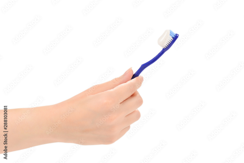Woman holds toothbrush with toothpaste in her hand isolated on white background. Woman holds toothbrush with toothpaste in her hand isolated on white background.