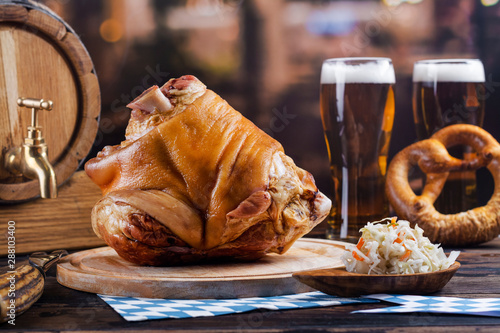 Photography Pork knuckle, beer and pretzels