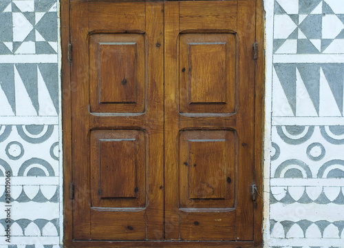 Wooden  on building exterior wall, Pyrgi village, Chios island, Greece. photo