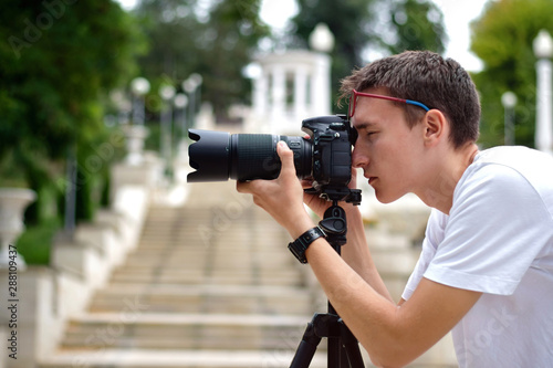 Man taking photos with a telephoto lens