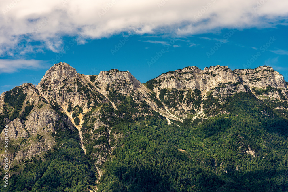Italian Alps near Trento, with the peaks of Vigolana and Becco di Filadonna photographed from the Caldonazzo lake, Trentino Alto Adige, Italy, south Europe
