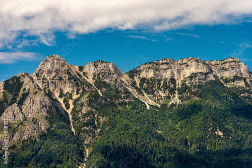 Italian Alps near Trento, with the peaks of Vigolana and Becco di Filadonna photographed from the Caldonazzo lake, Trentino Alto Adige, Italy, south Europe