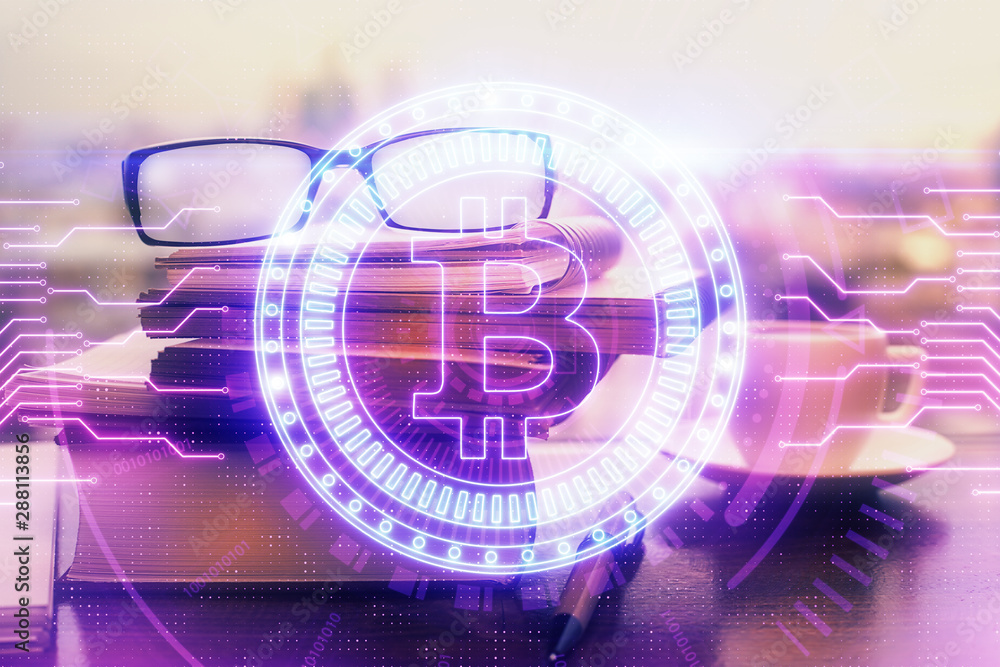 Obraz premium Crypto theme hologram with glasses on the table background. Concept of blockchain. Double exposure.