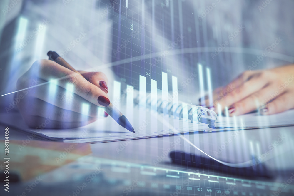 Double exposure of woman's hands making notes with forex graph hologram. Concept stock market analysis. Double exposure of woman's hands making notes with forex graph hologram. Concept stock market analysis.
