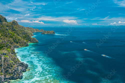 Fototapeta Naklejka Na Ścianę i Meble -  Aerial view of beautiful lagoons and limestone cliffs of Coron, Palawan, Philippines