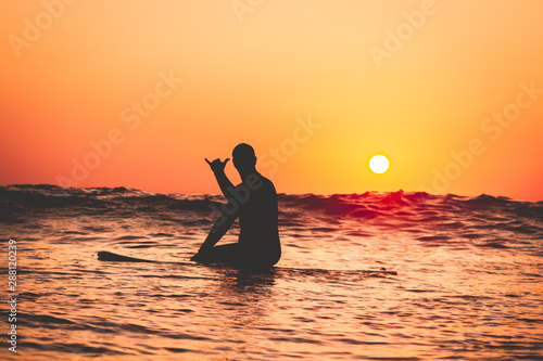 Surfer at the sea with surfboard 