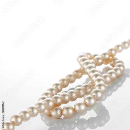 pearl necklace on white background.