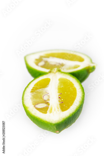 round slices of natural lime lemon with seeds on a white background