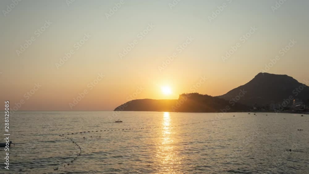 Beautiful Sunset on a Adriatic Sea beach at Sutomore Montenegro with mountain in the background. Beautiful Sunset on a Adriatic Sea beach at Sutomore Montenegro with mountain in the background.