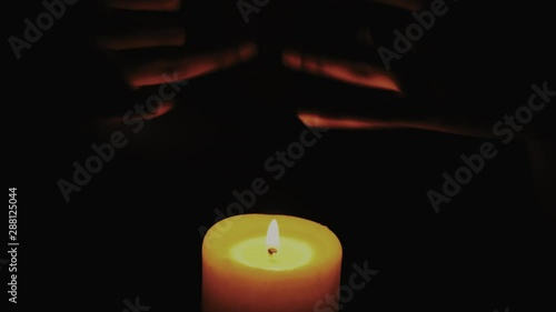 Elegant hands playing in candle light photo