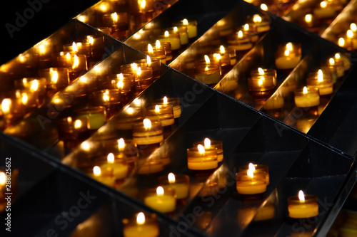 burning candles on a dark background, church