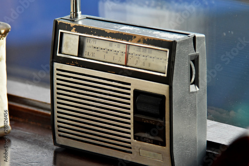 old radio with antenna, blurred background